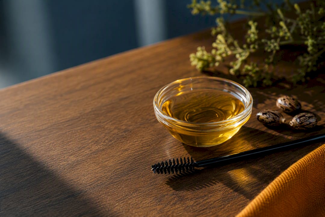Castor oil and clean eyebrow spoolie