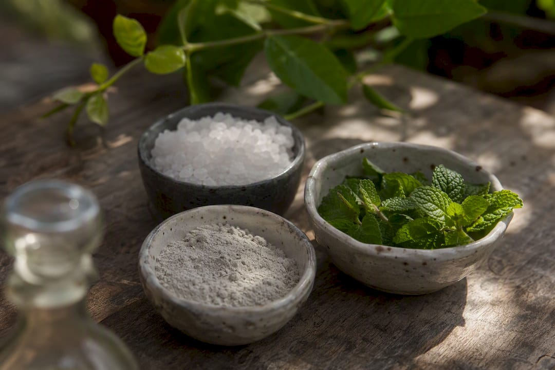Natural oral care ingredients on bathroom counter