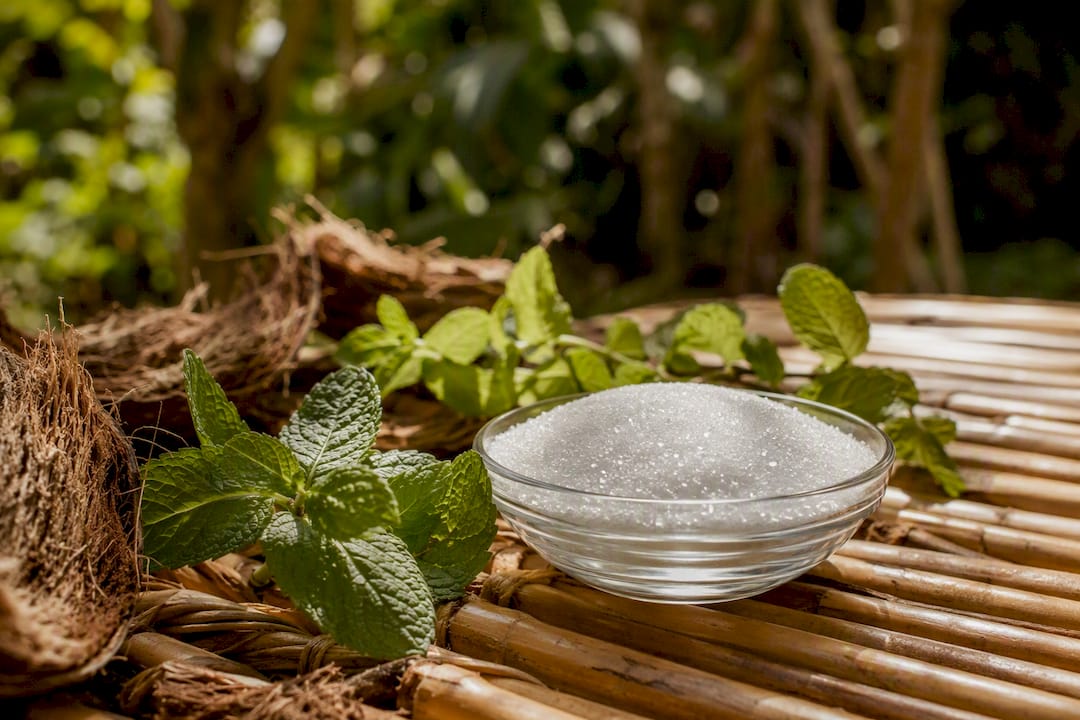 Glass bowl of xylitol with mint and coconut